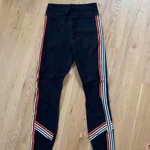 White Fox Boutique Black Leggings with Orange & White Side Stripes